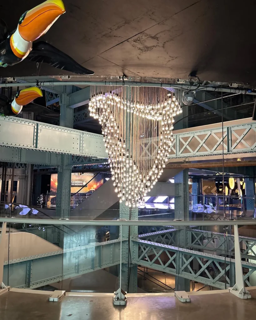 Architectural LED lighting: chandelier of hanging Edison bulbs in the Guinness Storehouse atrium